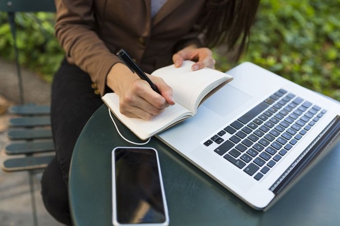 businesswoman with laptop sitting